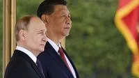 Putin backs China over Taiwan and dismisses fears about military cooperation