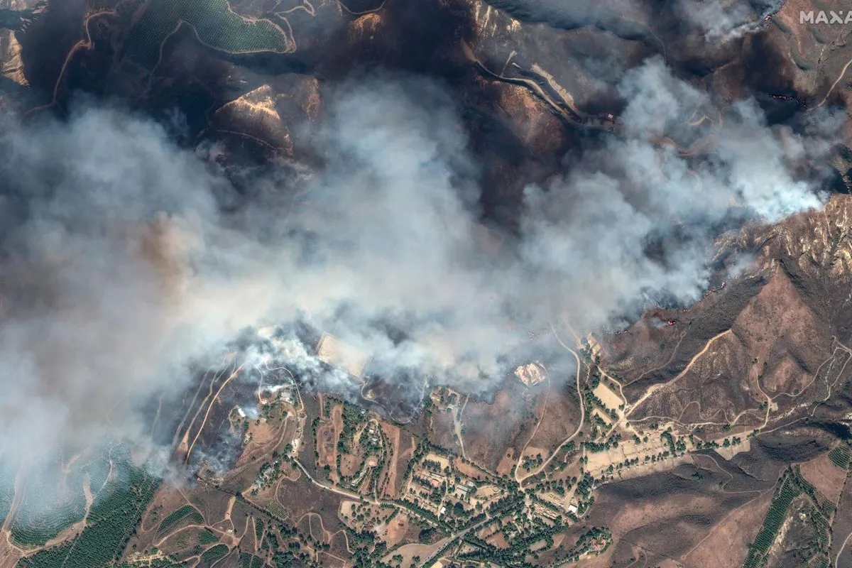 Massive LA wildfire forces thousands to leave homes as firefighters gain ground