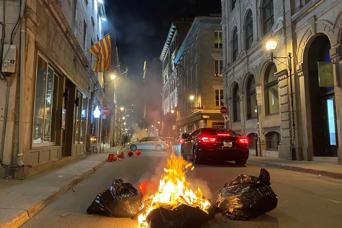 Montreal protest against NATO meeting ends with burning cars and arrests