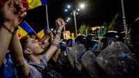 Romanian streets fill with protesters as unexpected presidential vote shocks nation